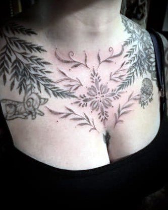 Botanical chest piece of fine-line flowers