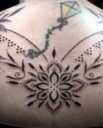Sternum mandala with pendant detailing
